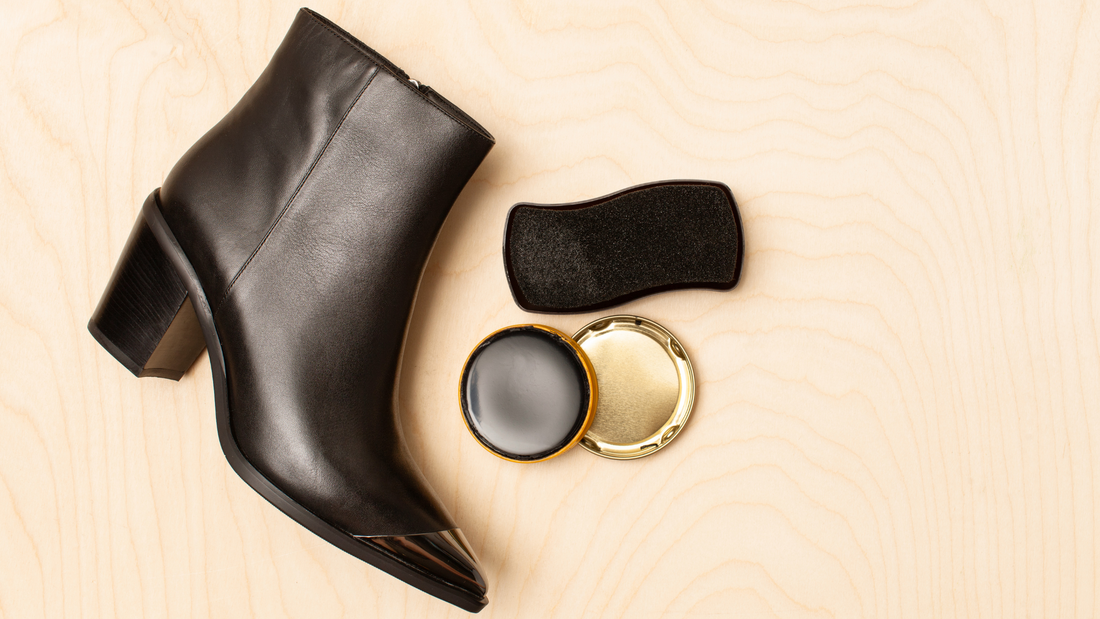 Small size black leather cowboy ankle boots and shoe care accessories