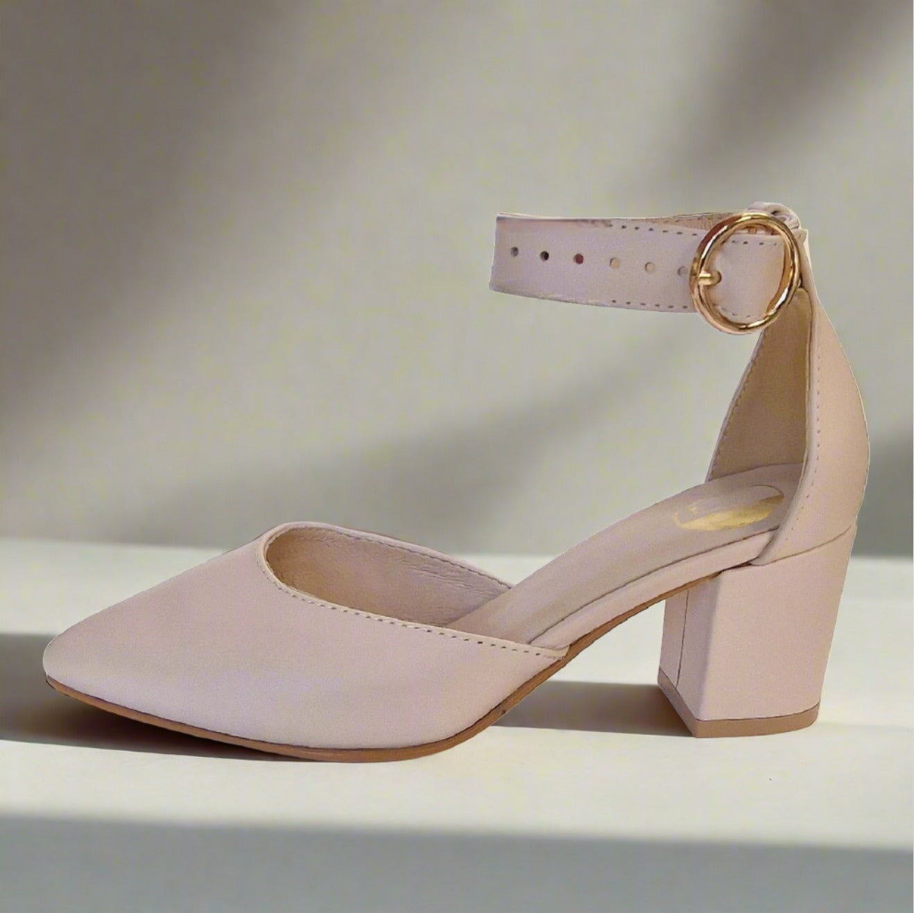 Block kitten heel ankle strap court shoes in nude leather.