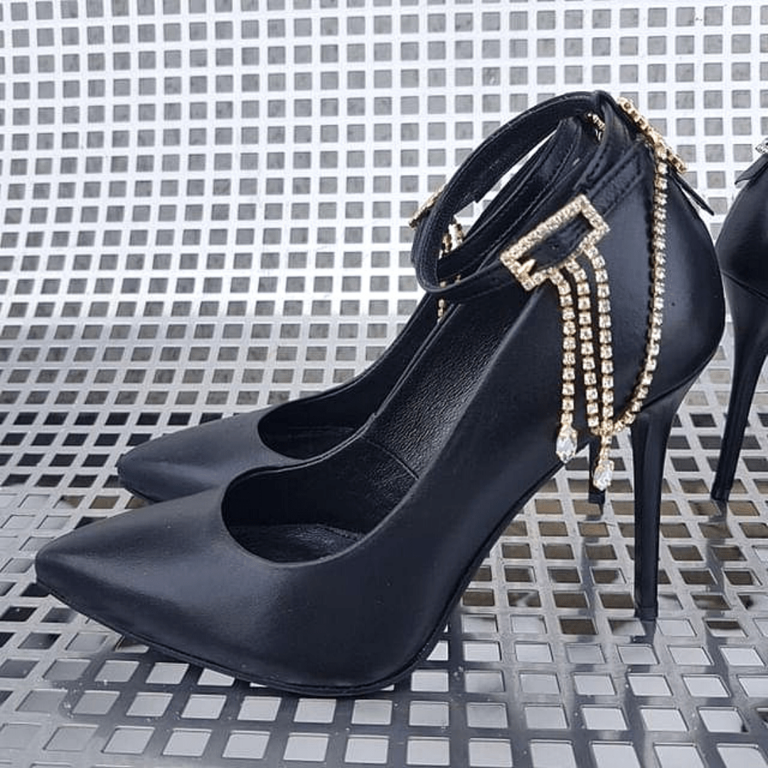Black leather court heels with fold chain