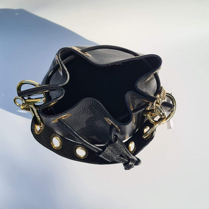Small bucket back in black leather with a gold strap