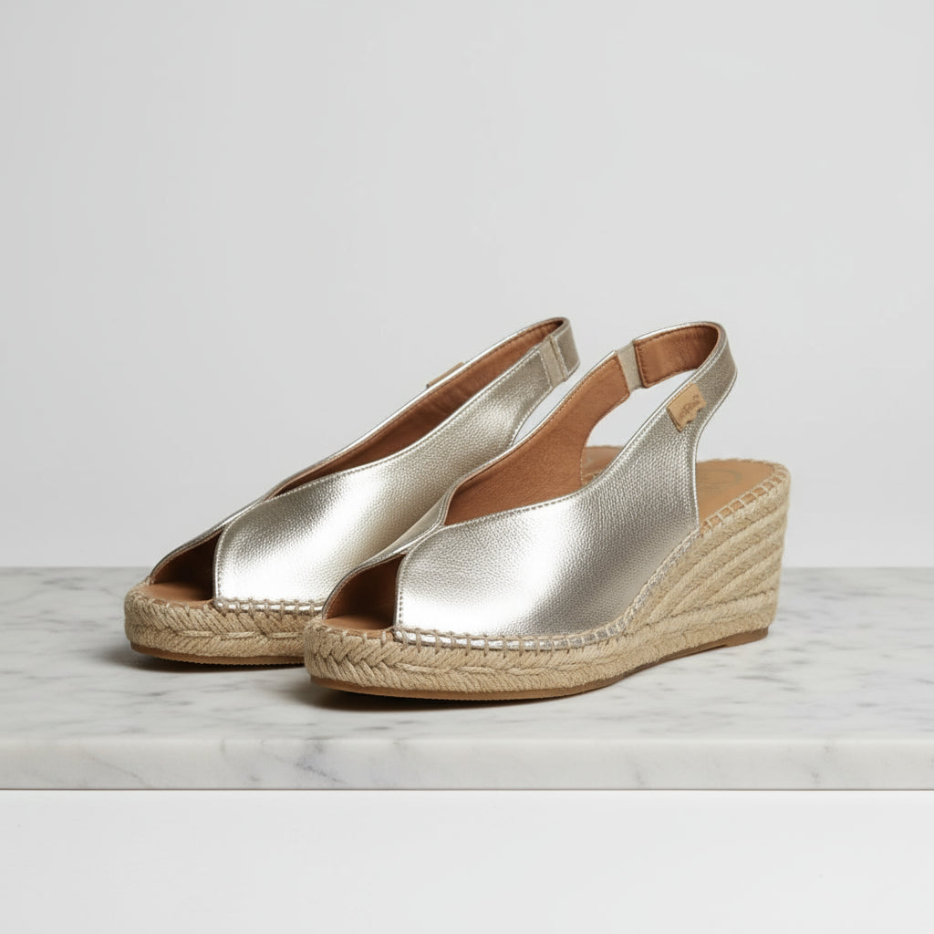 ARIES gold metallic leather espadrilles with 7cm jute wedge heel design.