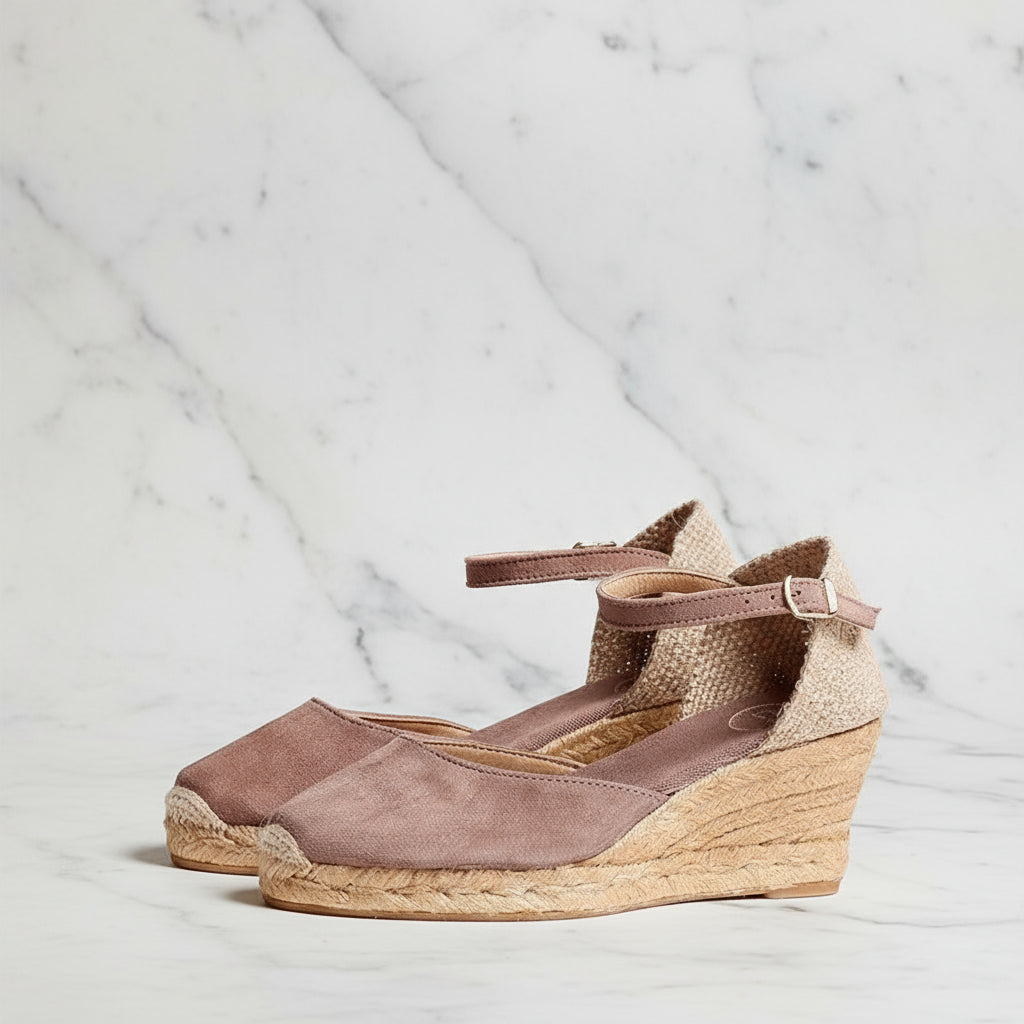 Angled view of taupe suede MARIGOLD espadrilles showing jute detailing and ankle strap closure.