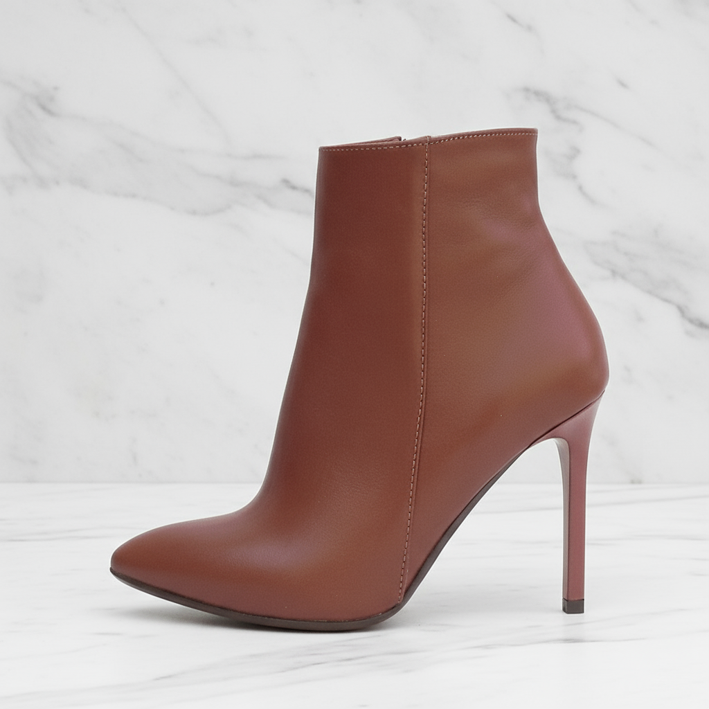 Brown high-heeled ankle boot on a white background