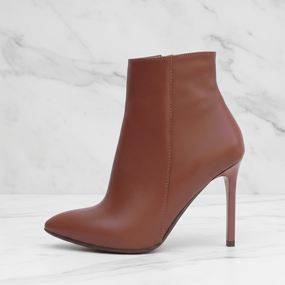 Brown high-heeled ankle boot on a white background