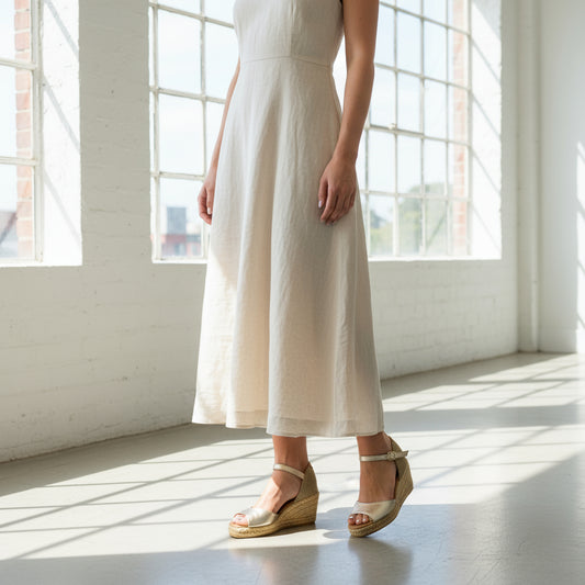 ALISIA gold espadrilles with jute wedge worn with black leggings, perfect petite wedges for small feet.