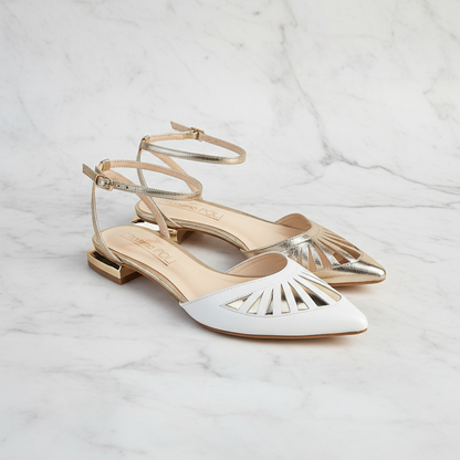 White and gold shoes on a marble background