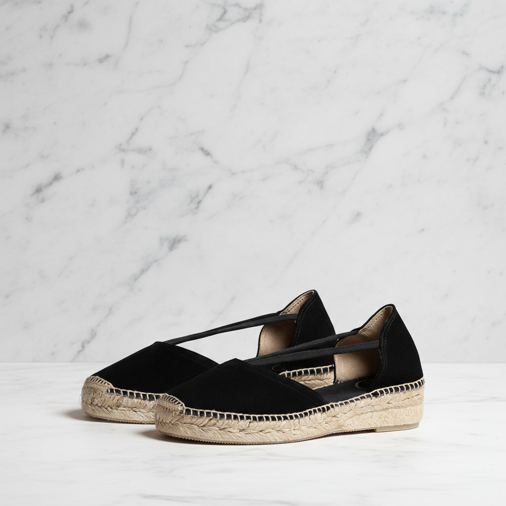 Pair of black suede espadrilles with elastic crossover straps and jute platform sole for petite shoe sizes.