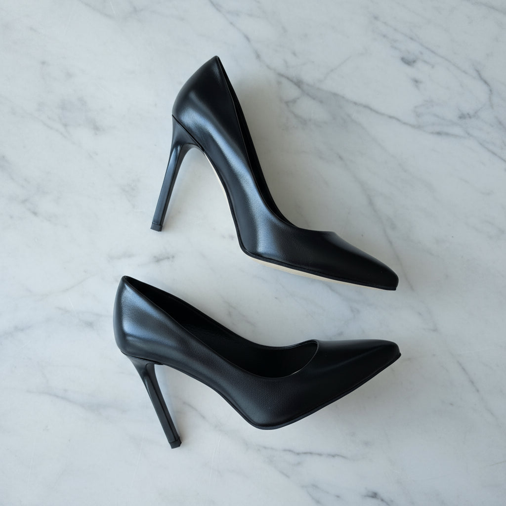 Side view of black leather FELICIA pointed toe heels with 9cm stiletto heel