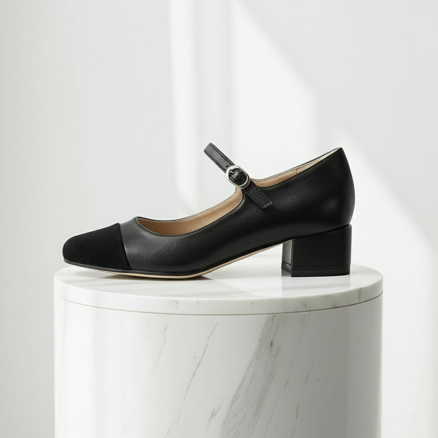 MILA black leather Mary Jane shoes with suede toe cap and silver buckle, featuring a 4.5cm heel on marble surface.