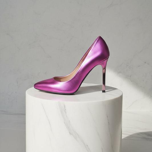 Purple high-heeled shoe on a white pedestal against a light gray background