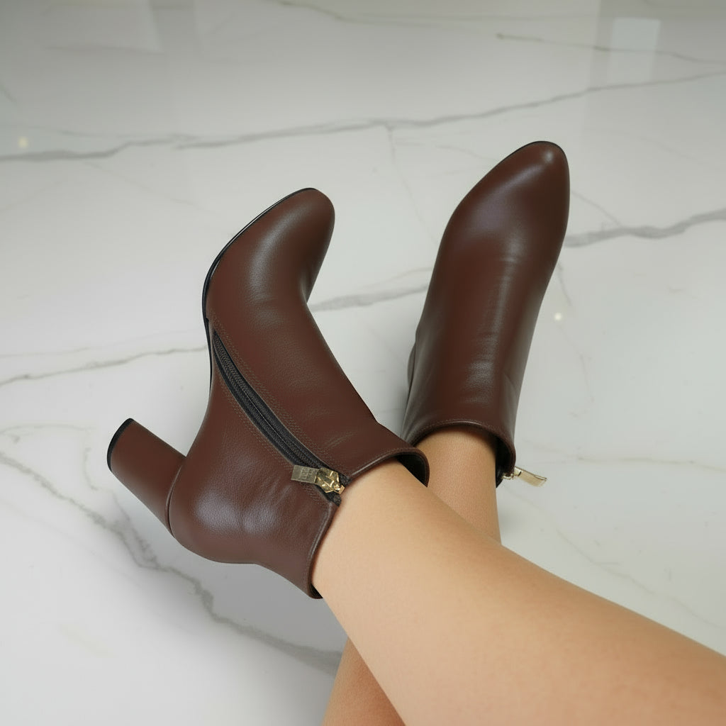 CELIA brown ankle boots worn, showing side zip and elegant 8cm heel.