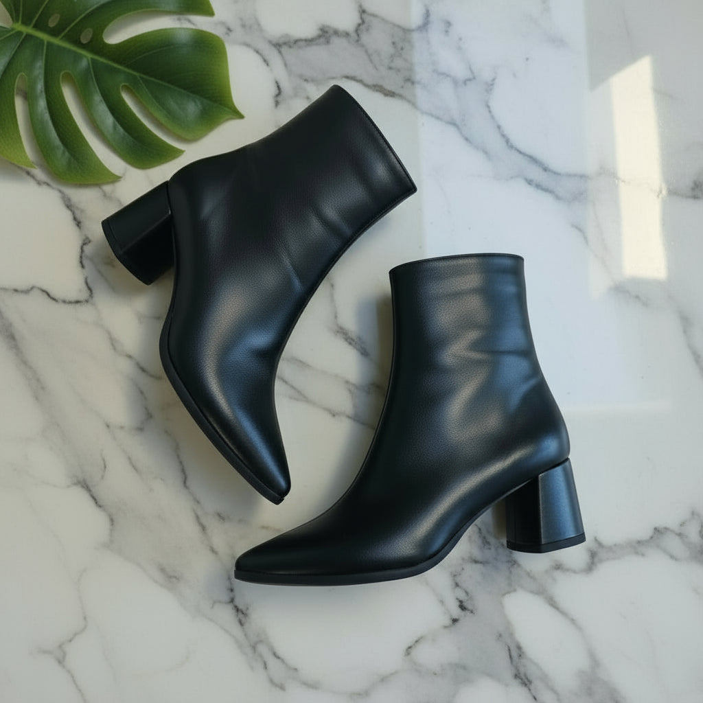 CORA black leather ankle boots flat lay — 6cm block heel, pointed toe, leather lining.