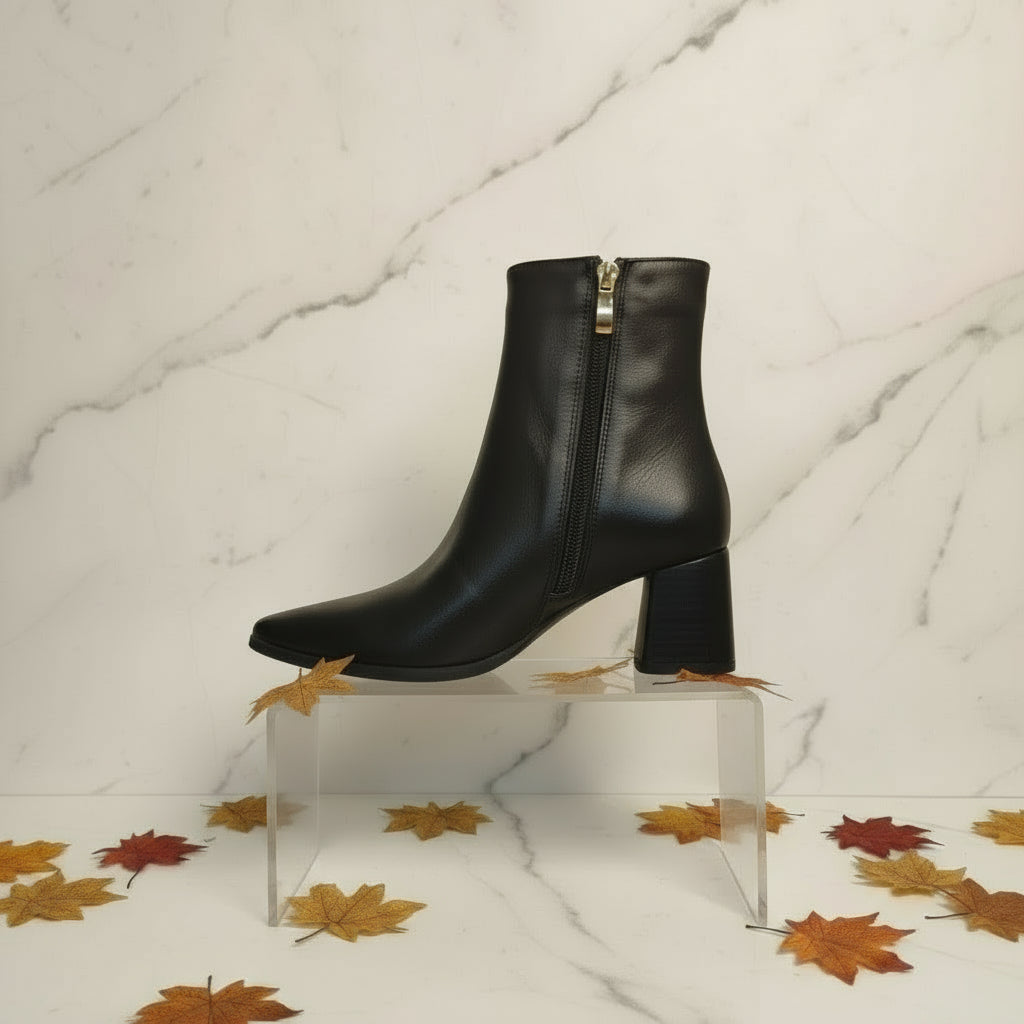 Profile picture of black ankle boots with a side zip.