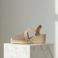 Profile view of taupe HAZEL espadrille showing 6cm wedge heel and elastic crossover band design for petite feet.
