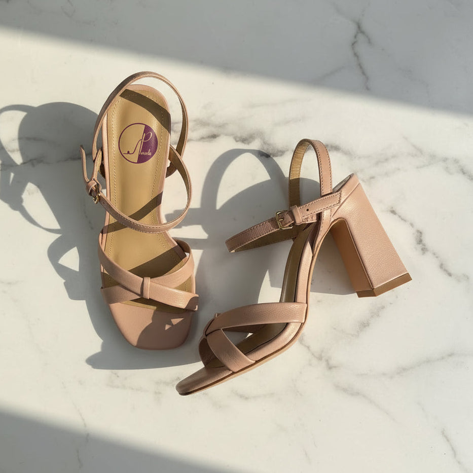 Overhead view of IRIS petite leather sandals in nude, highlighting crossed front straps, block heel and padded insole.