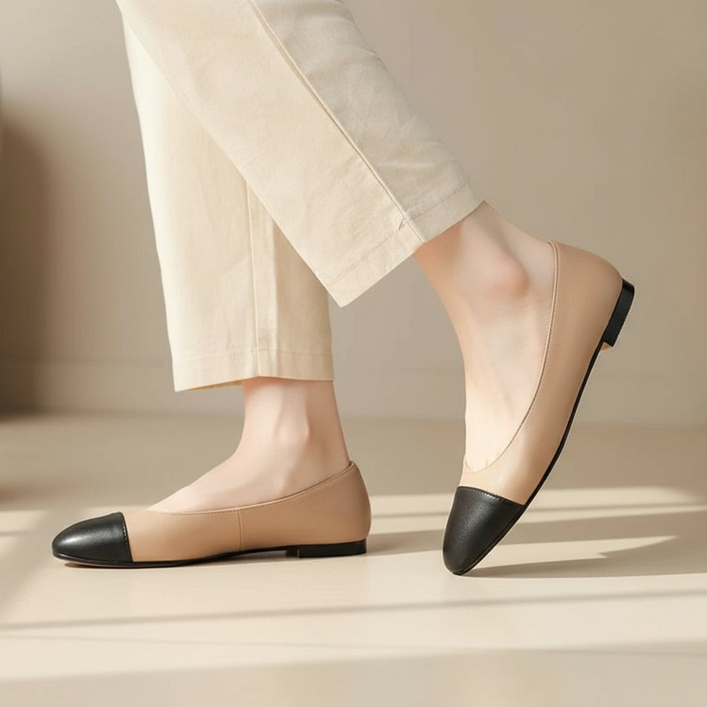 Single step showing beige and black leather ballerina flats designed for petite feet