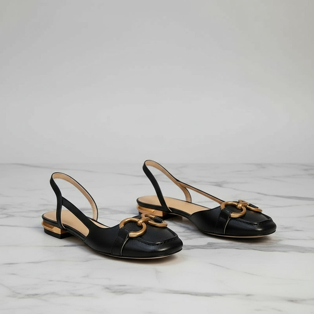 JANE black leather slingback flats with gold hardware displayed beside woven basket, elegant petite footwear option.
