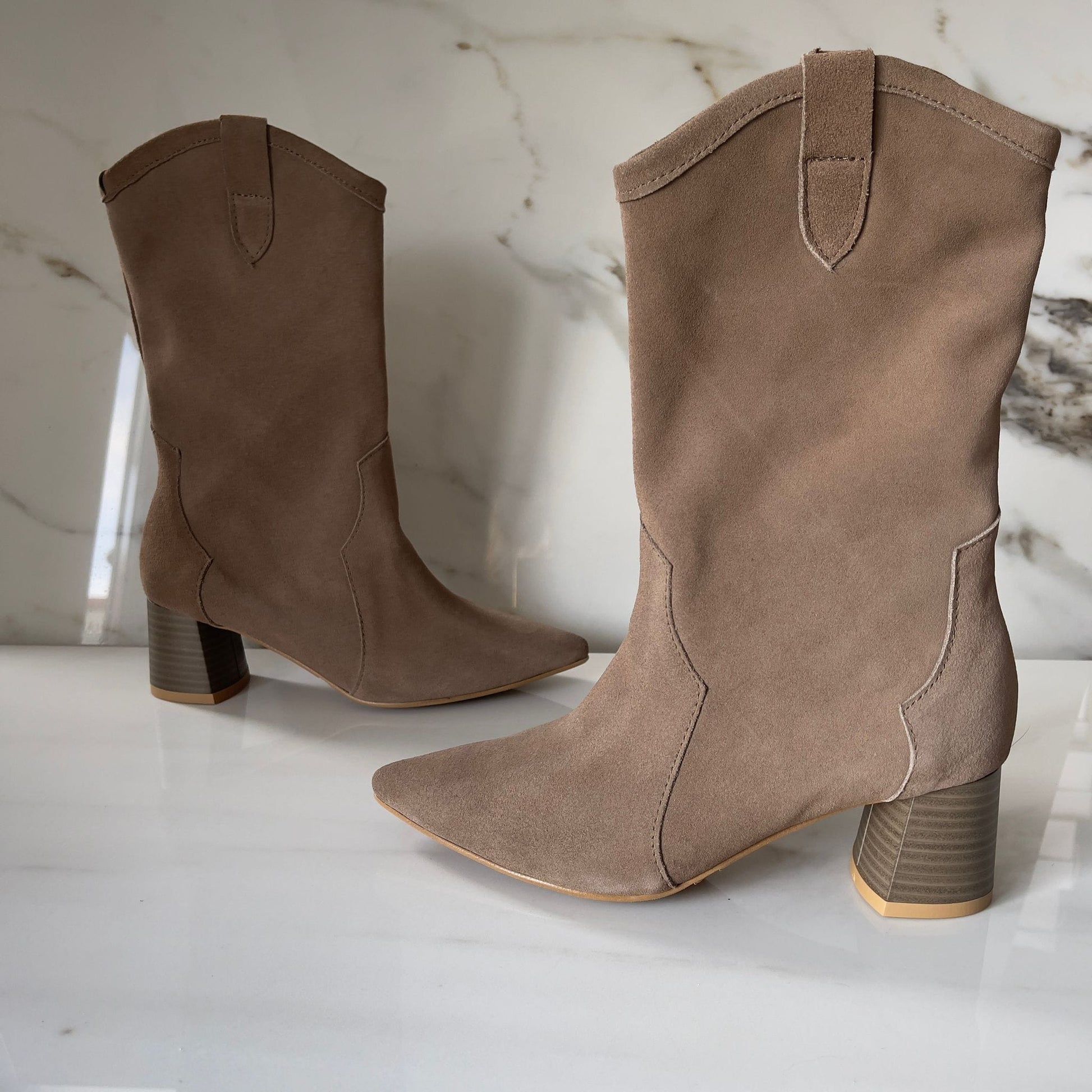 Beige suede ladies western boots set on a cuban heel