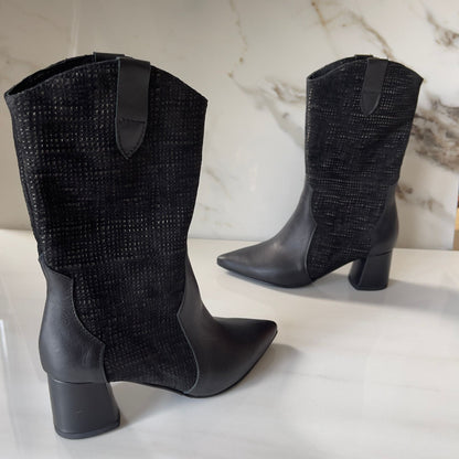 Black leather cowboy boots set on a cuban heel