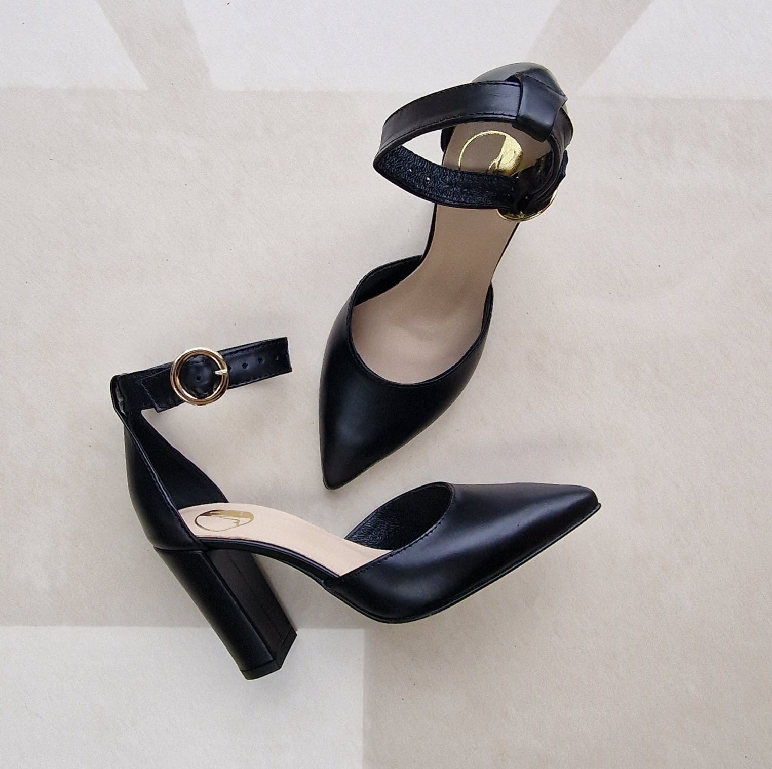 Pointed toe black leather ankle strap court shoes