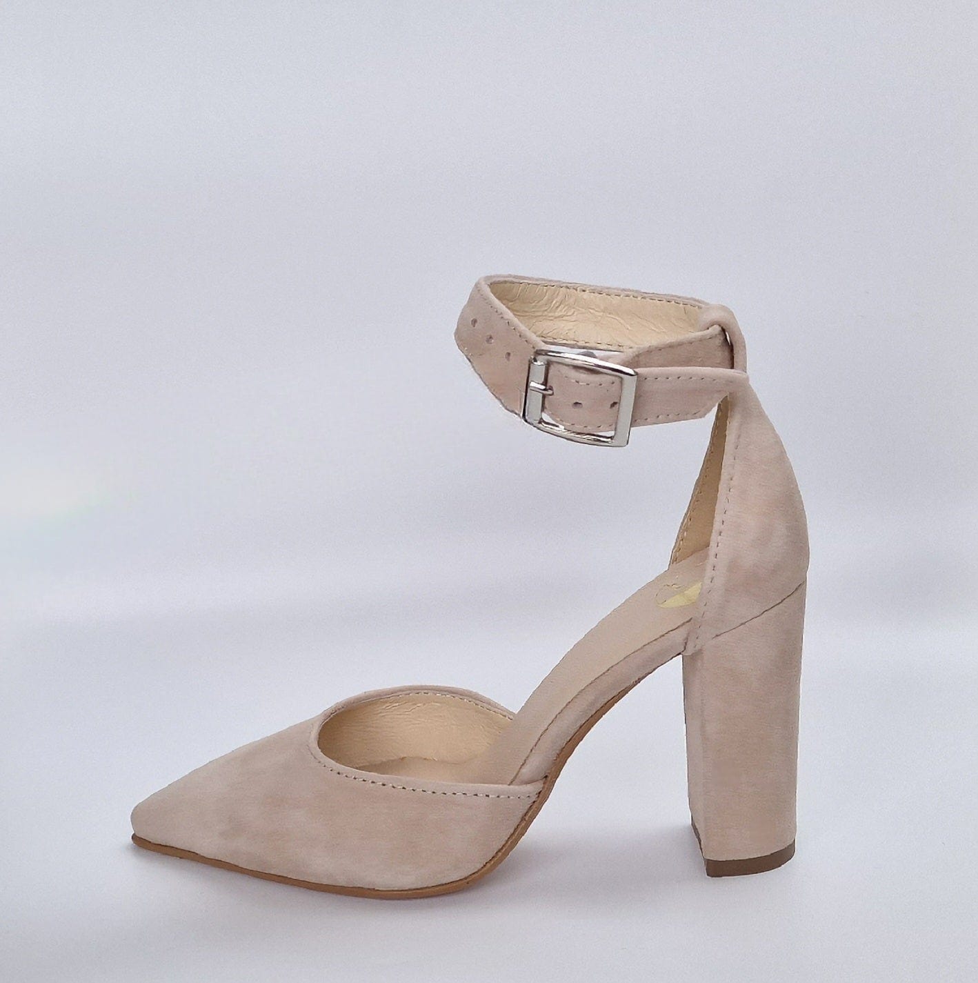 Nude suede ankle strap court heels