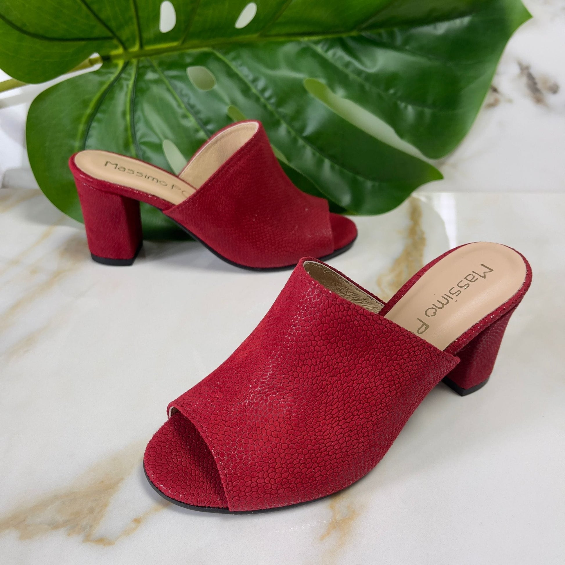 Red leather open toe mules set on a block heel