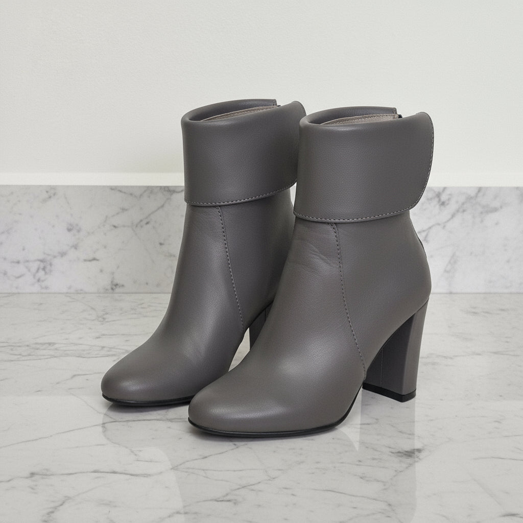  Grey leather calf boots with fold-over flap and 8cm block heel shown from side and back view