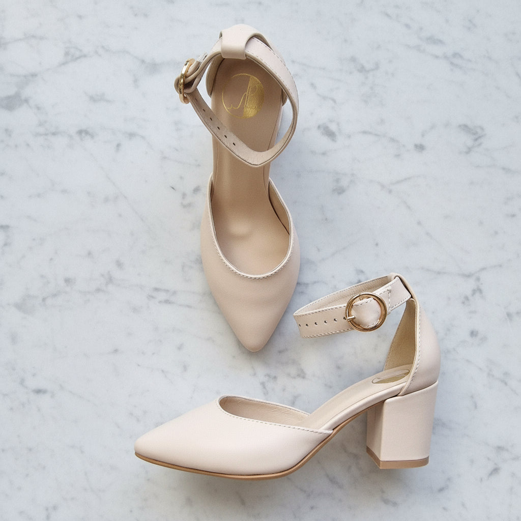 Block kitten heel ankle strap court shoes in nude leather.