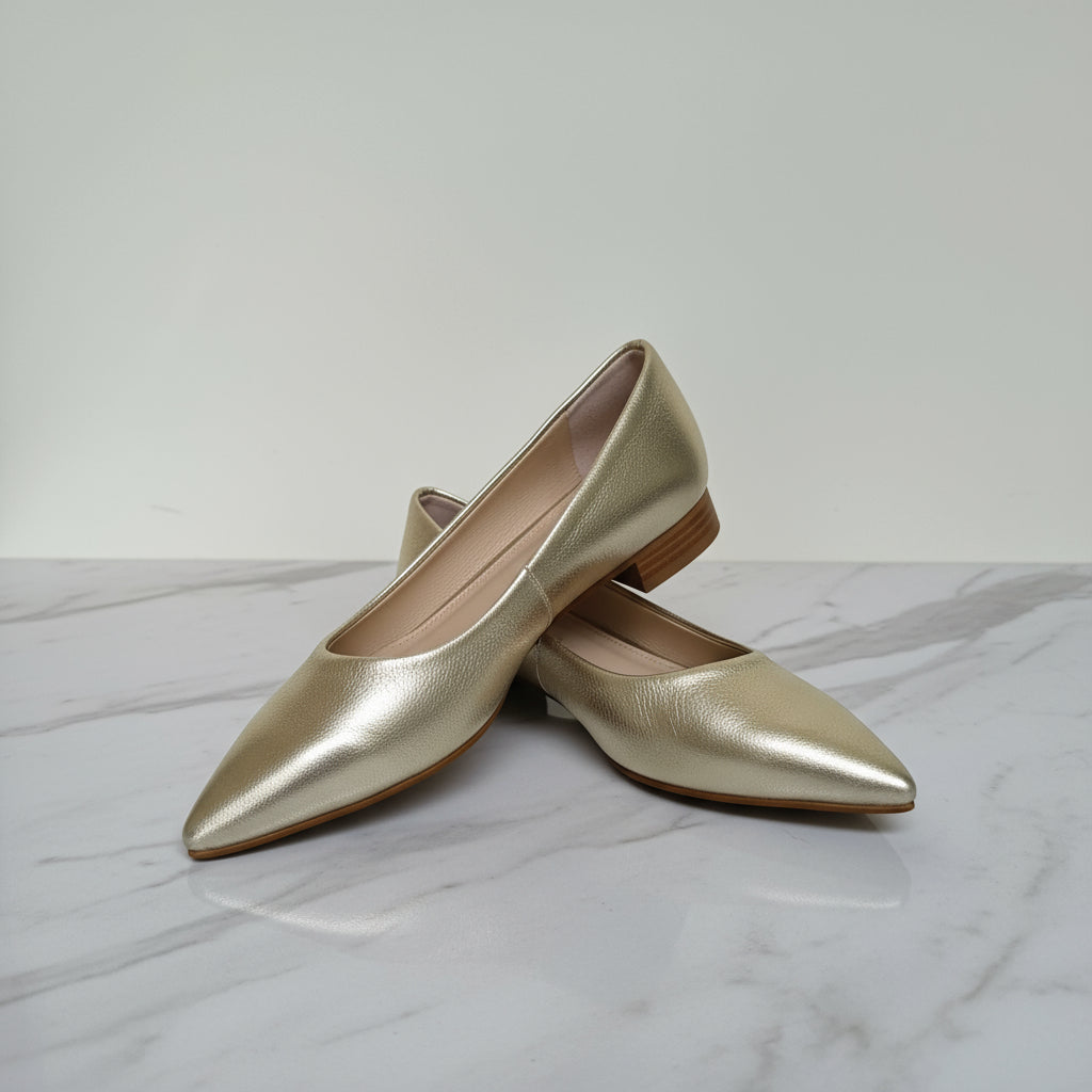 Side and top flat lay of petite small size gold leather ballerinas with pointed toes