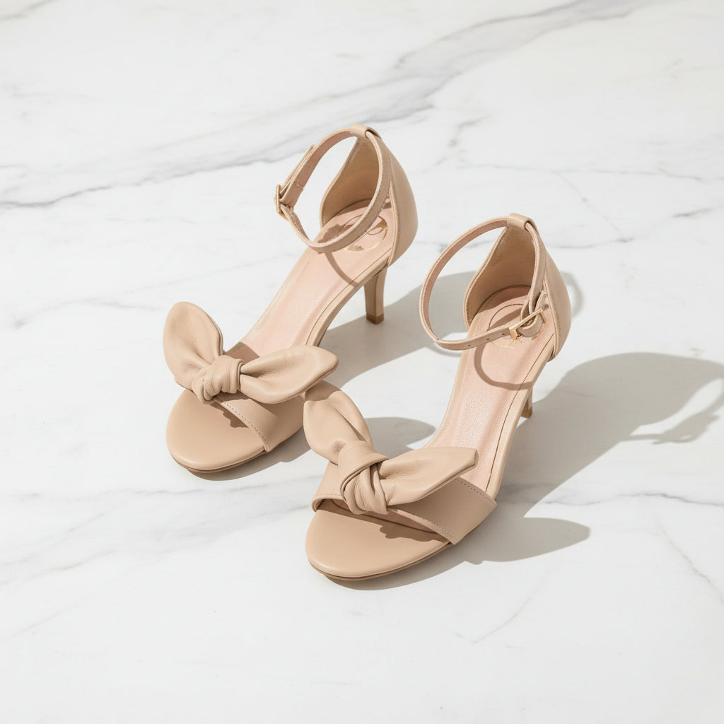 PATRICIA nude leather sandals with removable bow, slim ankle strap and 7cm kitten heel for petite proportions.
