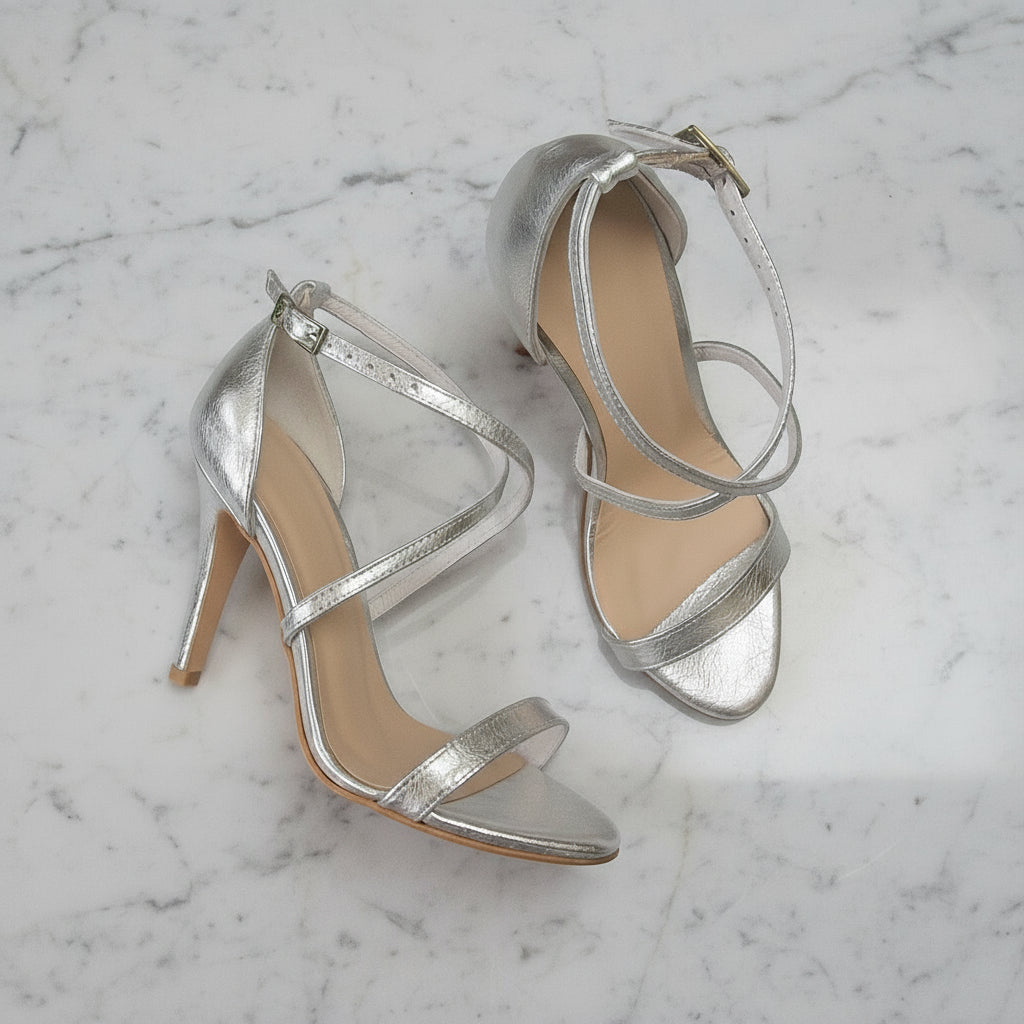Top view of FLORENCE silver petite sandals showing slim crossover straps and cushioned leather lining.