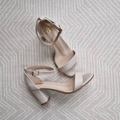 Nude leather ankle strap sandals set on a block heel