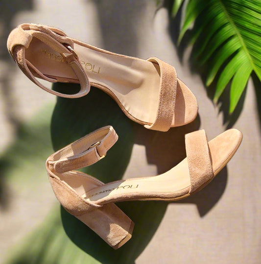 Nude suede leather ankle strap sandals set on a mid heel