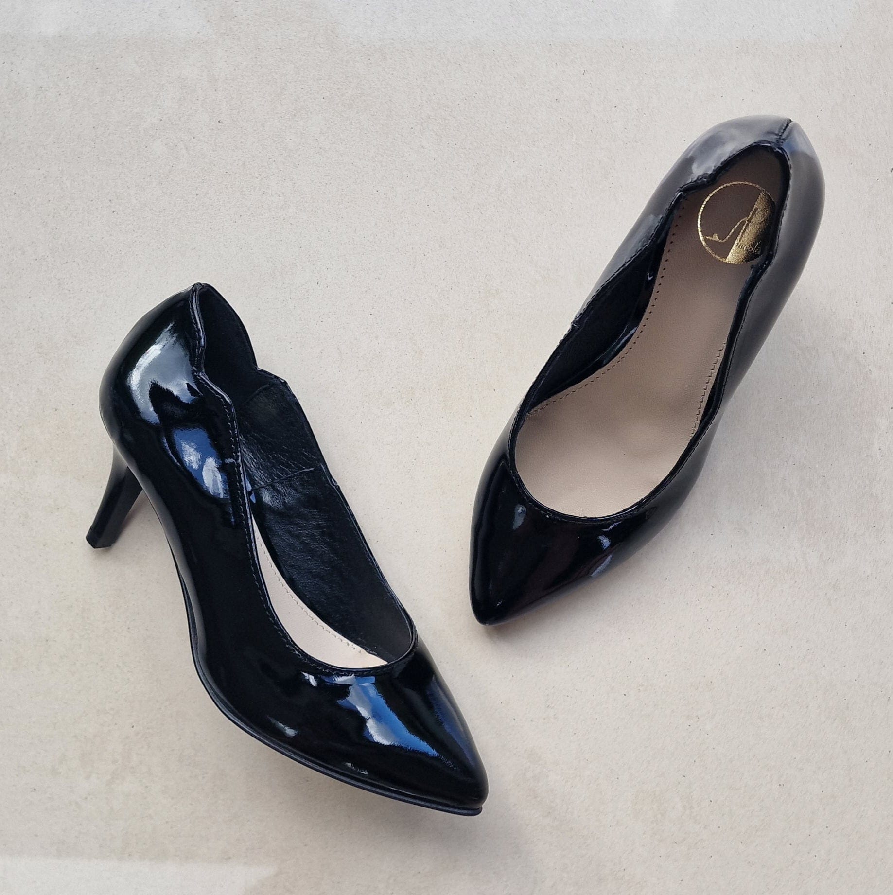 Kitten heel black patent court heels