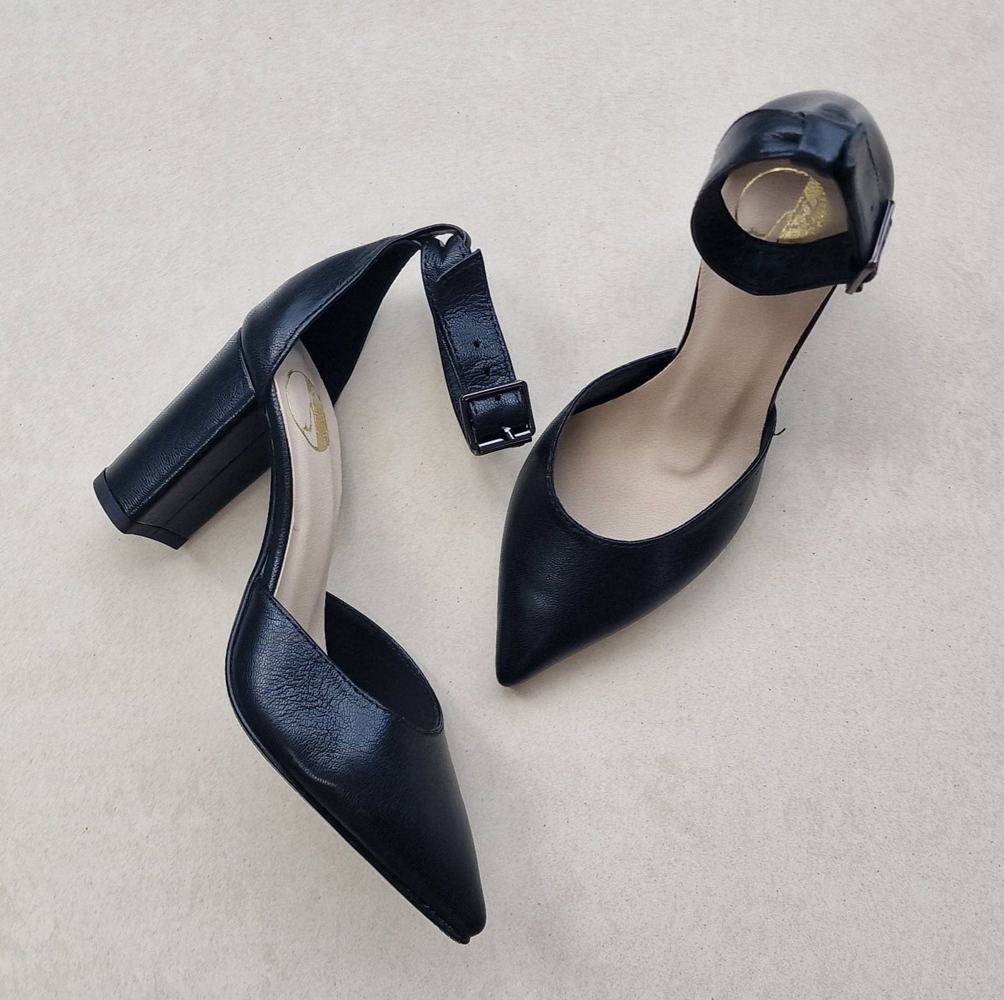 Pointed toe black leather court shoes with ankle strap