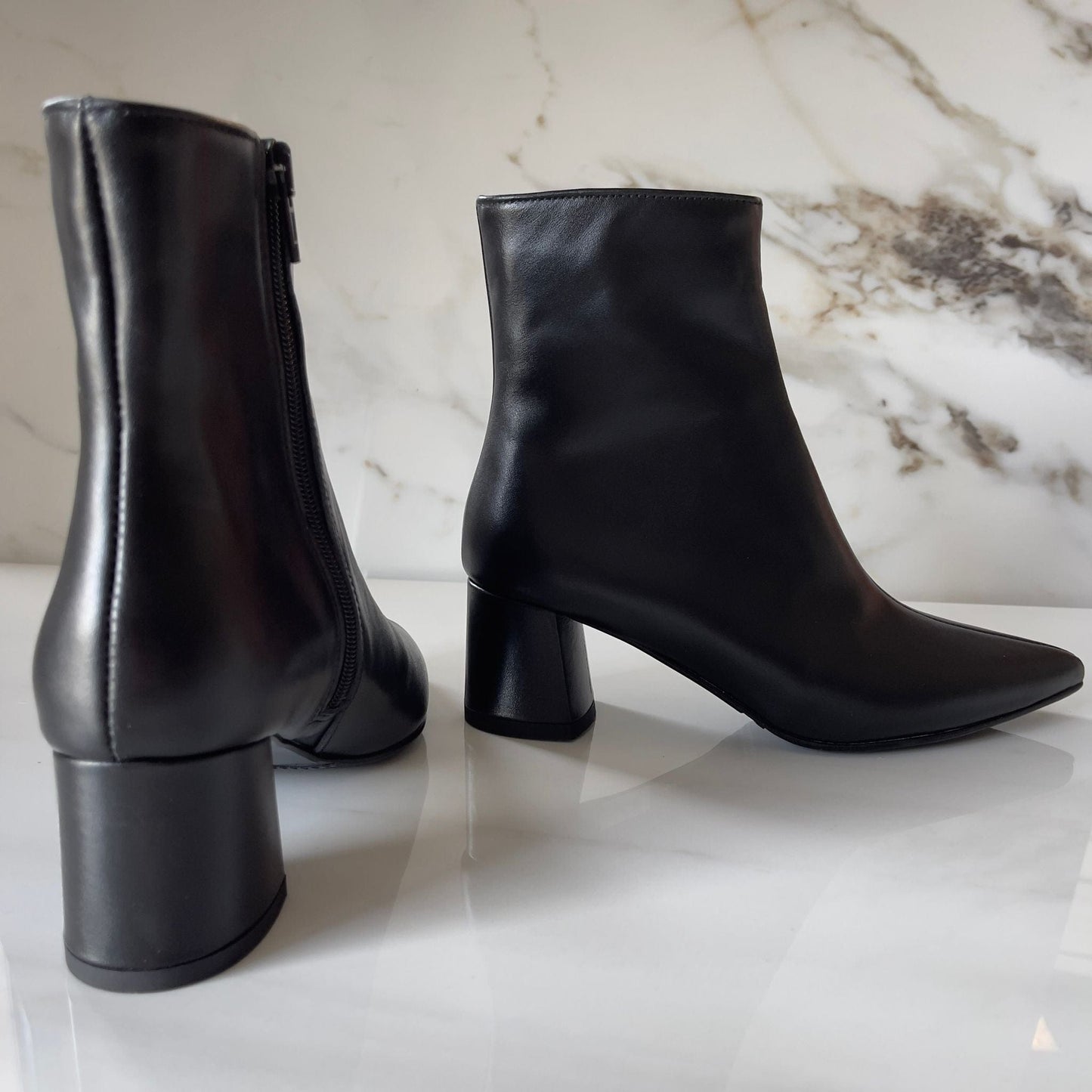 Pointed toe block heel ankle boots in black leather
