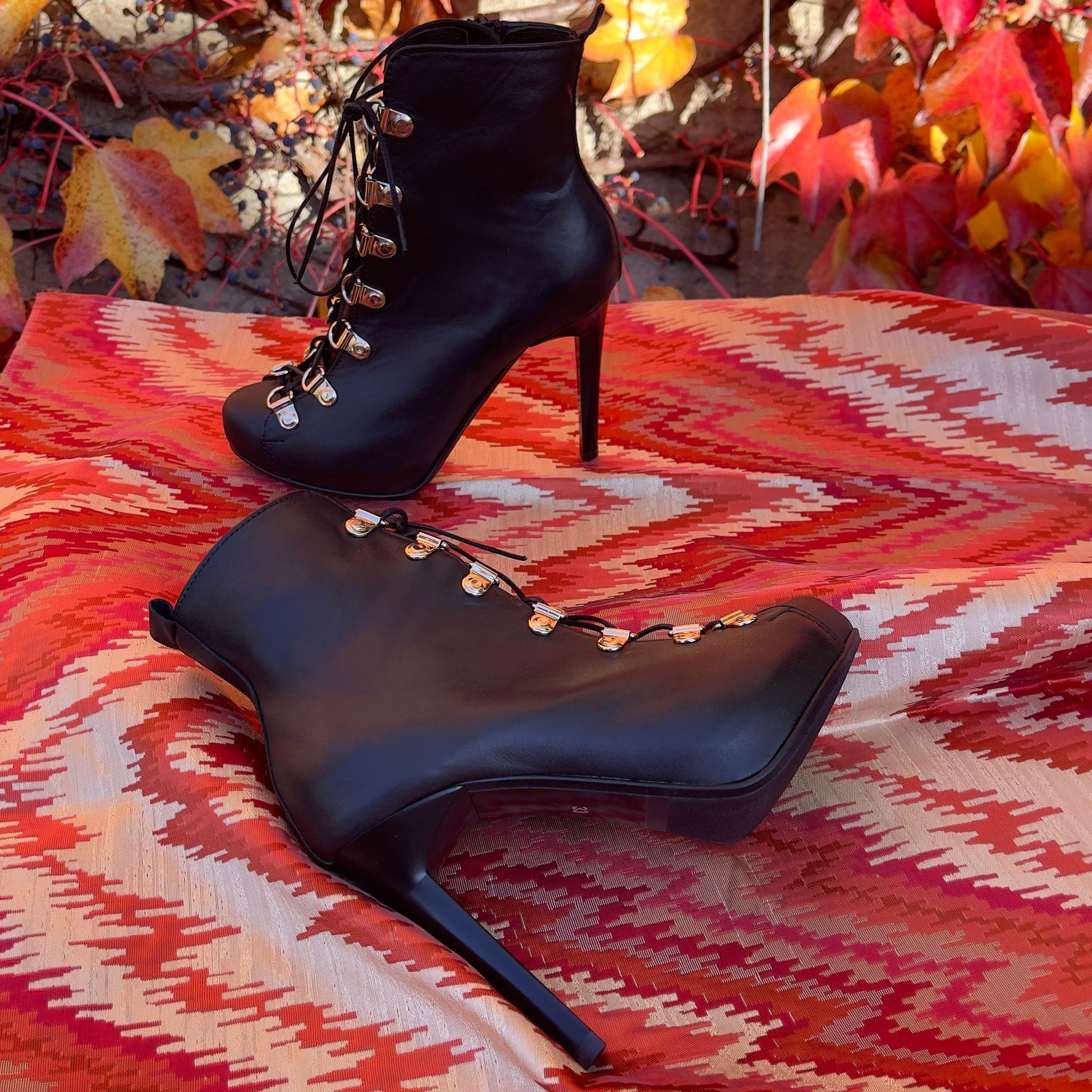 High heel platform boots in black leather
