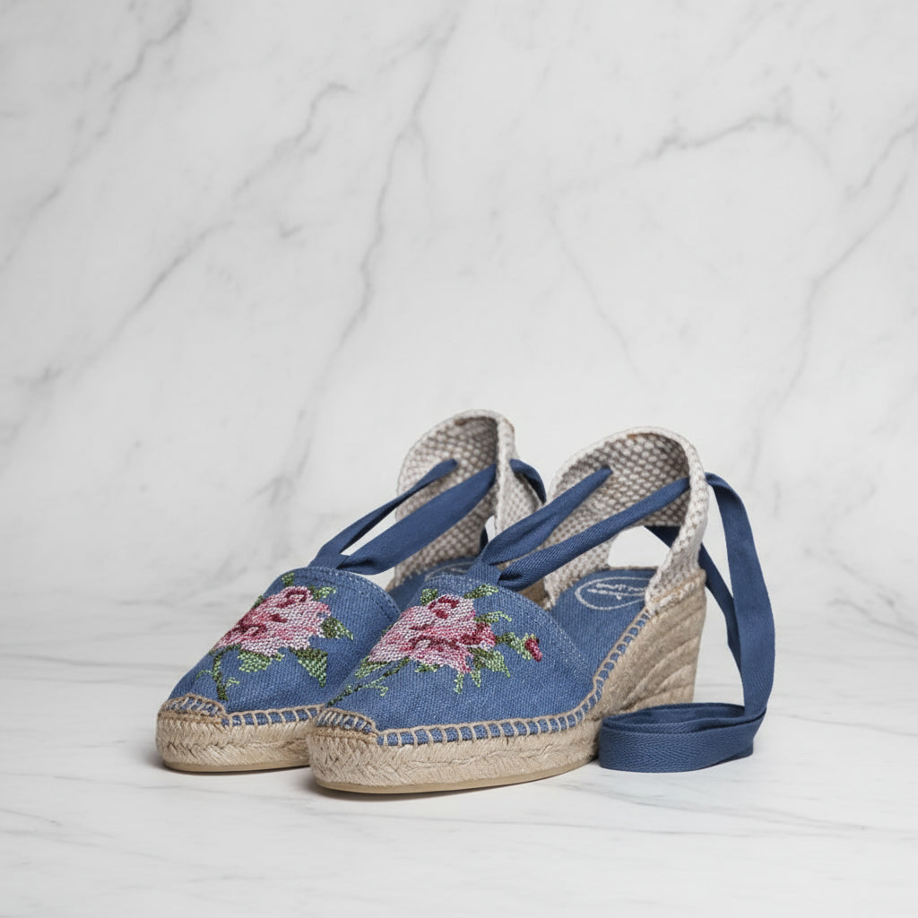 Side angle of VENICE blue canvas espadrilles with floral embroidery and ribbon ties for smaller feet
