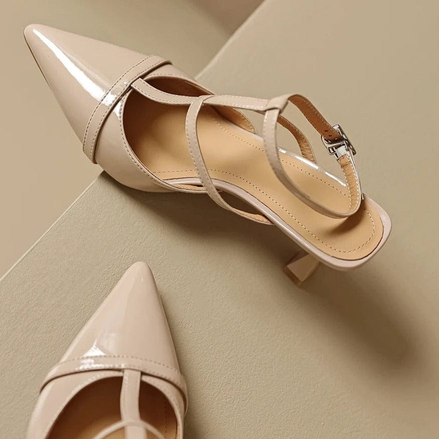 A pair of beige pointed-toe patent leather heels with delicate straps and a 5cm kitten heel, designed for women with smaller feet.