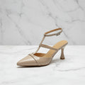 Beige patent leather kitten heel slingback shoes