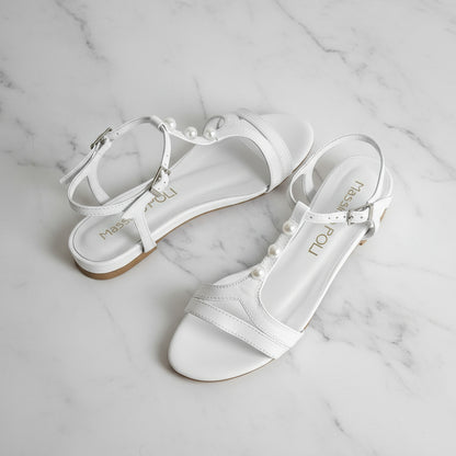 SANTI white leather sandals with pearl T-strap and 2cm heel on marble, perfect for petite feet