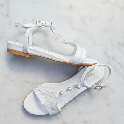 SANTI white genuine leather sandals with pearl T-strap against blue sky, 2cm heel for petite women