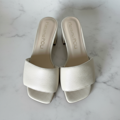 Top down view of cream leather ROBIN sandals with cushioned leather lining.