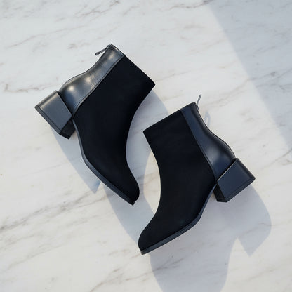 Petite black leather ankle boots with block heel and zip at the back.