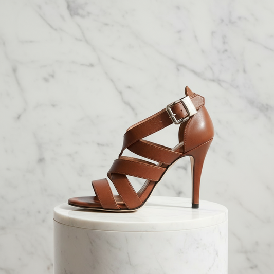 Brown high-heeled sandal with a buckle on a white background