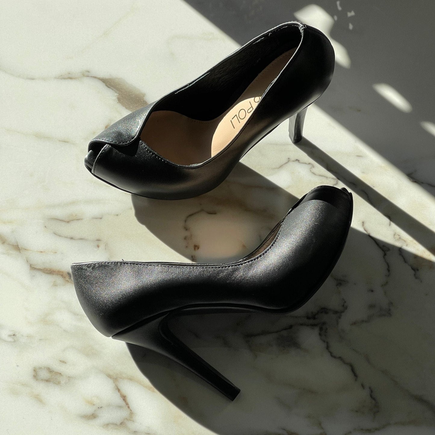 Black leather peep toe court shoes