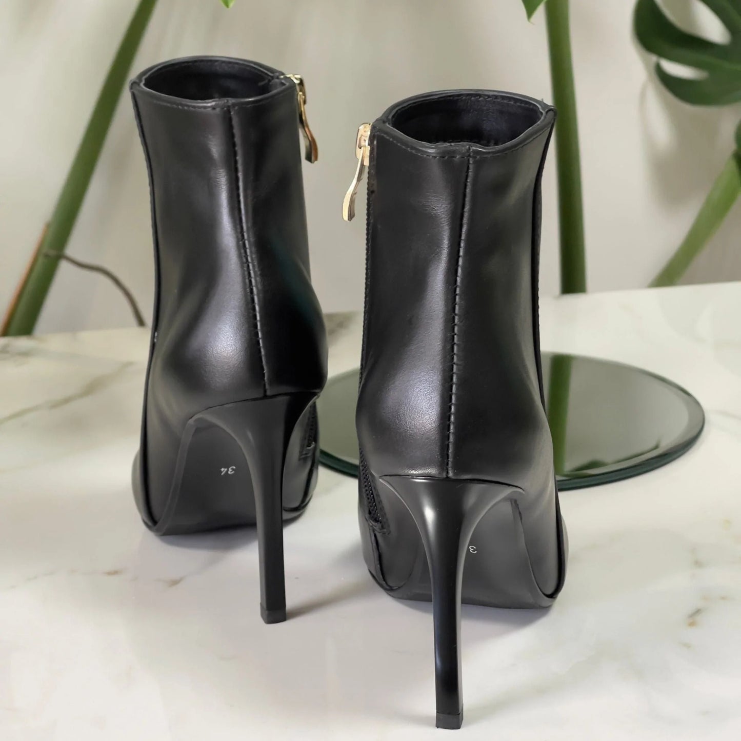 Small size ladies ankle boots in black leather