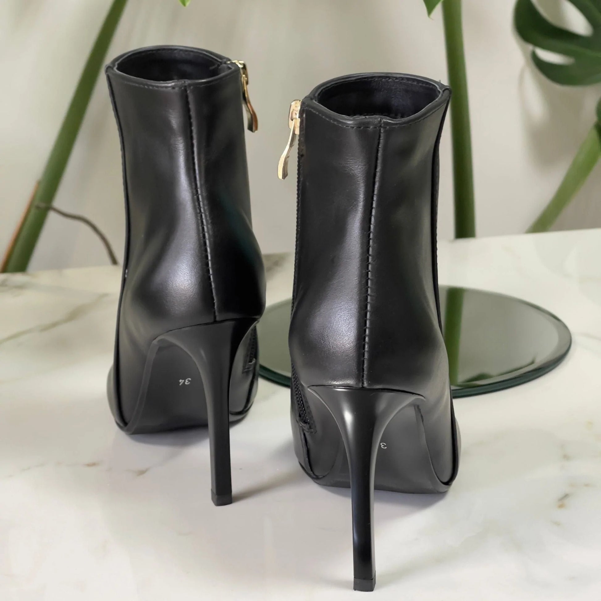 Small size ladies ankle boots in black leather