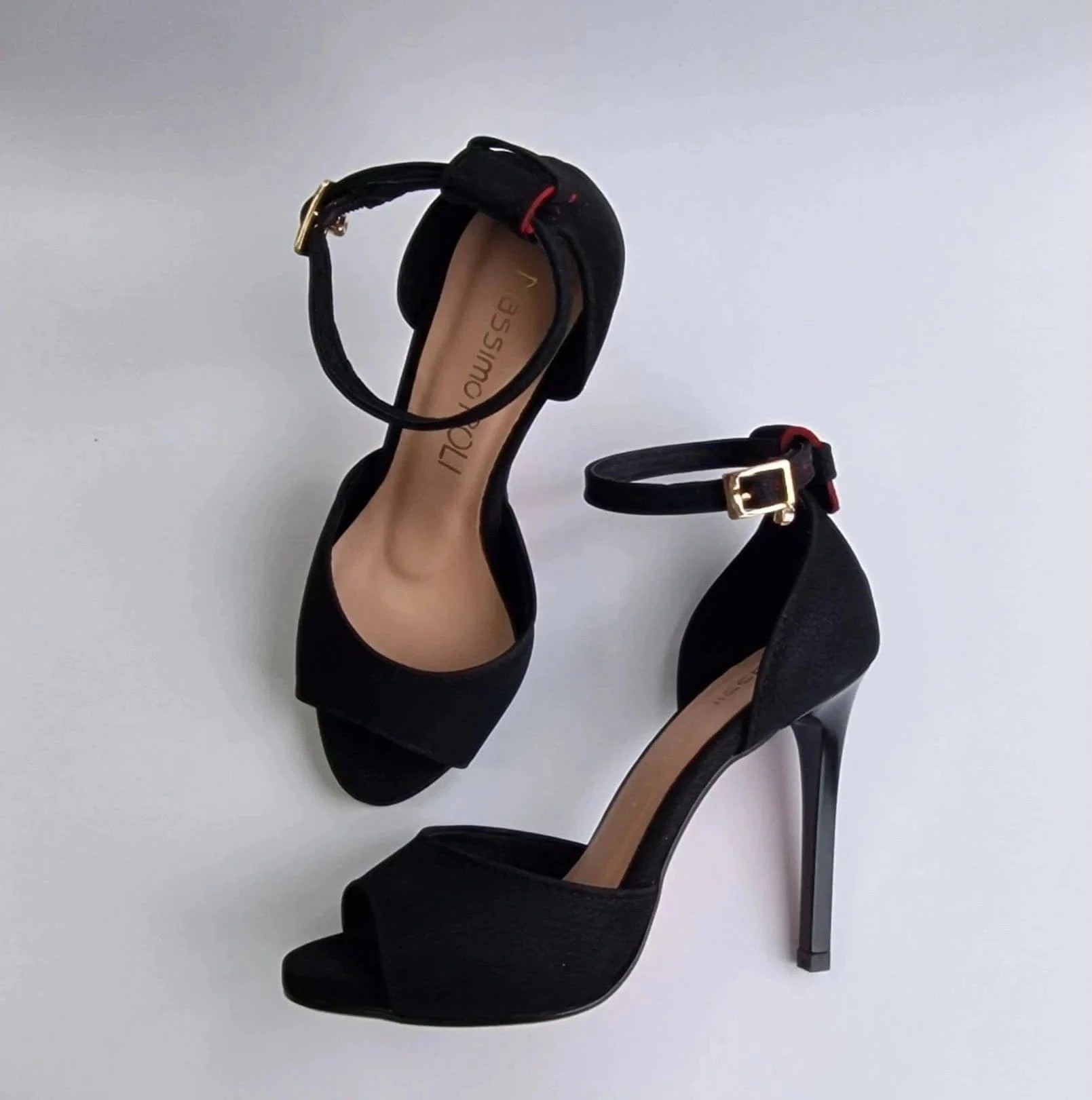 Black high heel sales shoes with red soles