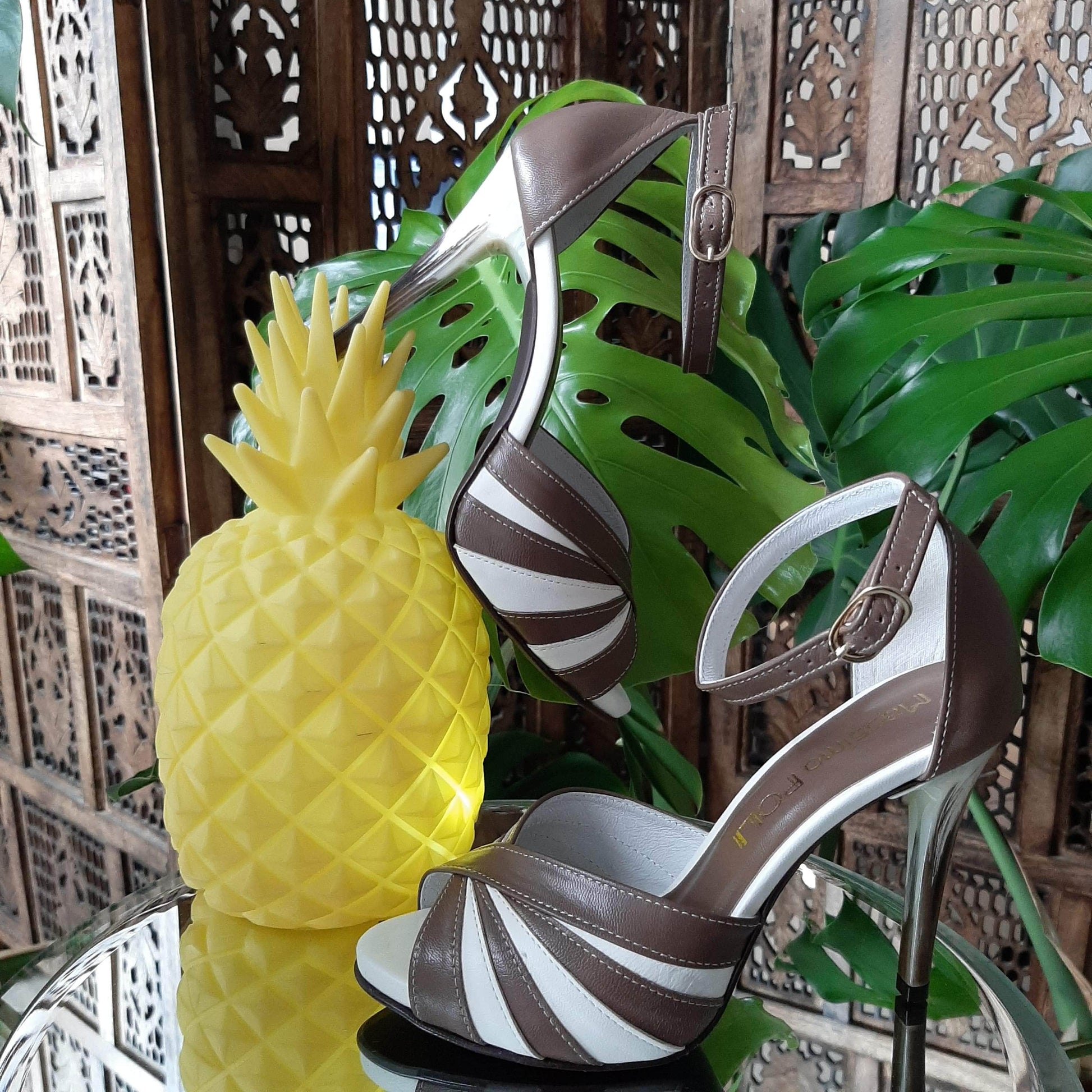 Yellow pineaple and high heel shoes